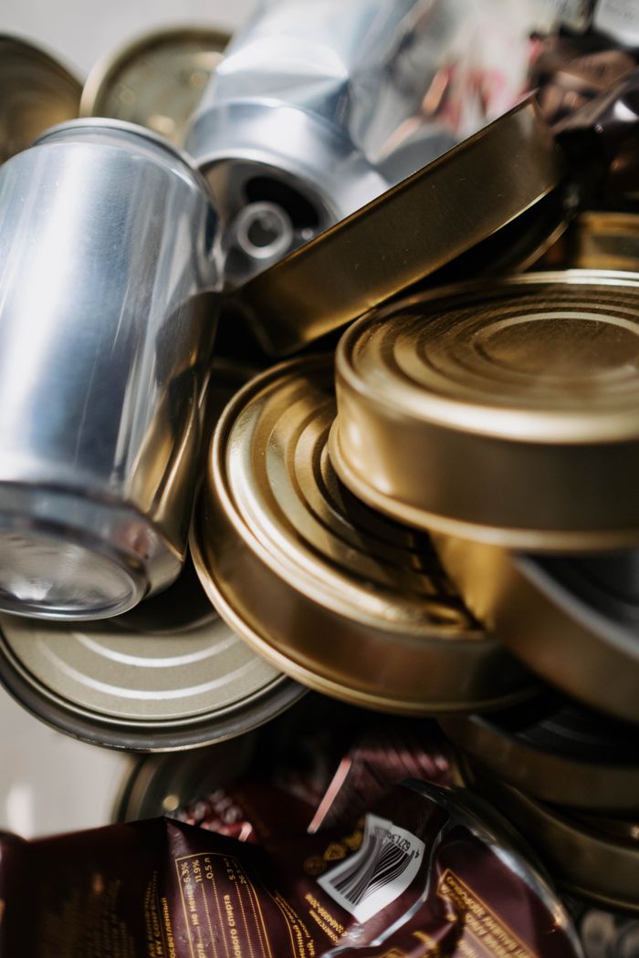 our-story Close-up of mixed aluminum and tin cans ready for recycling.